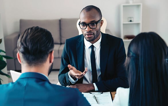 Business professional leading a meeting to demonstrate strong emotional intelligence skills