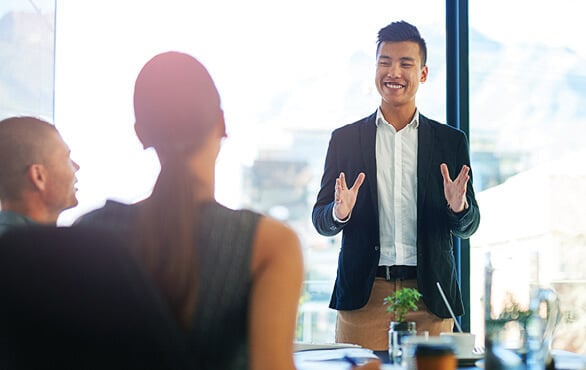 Sales team collaborating during training to develop essential selling techniques