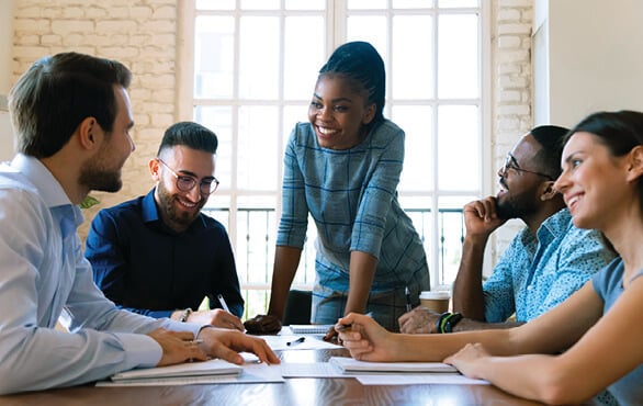 Diverse team collaborating on effective people management strategies.