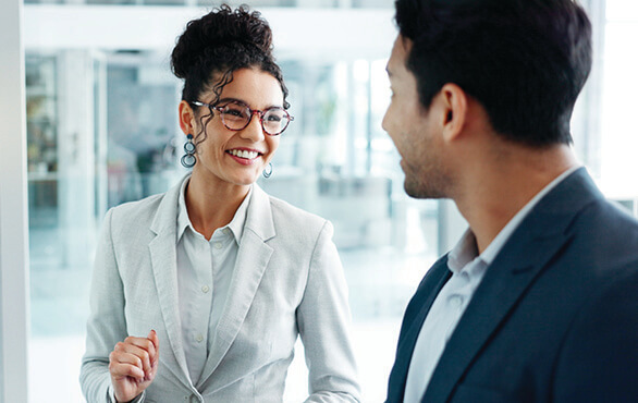 Business professionals discussing workplace communication strategies during a leadership training session