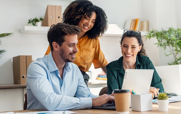 Business professionals collaborating on AI strategy and digital transformation initiatives in a modern office environment