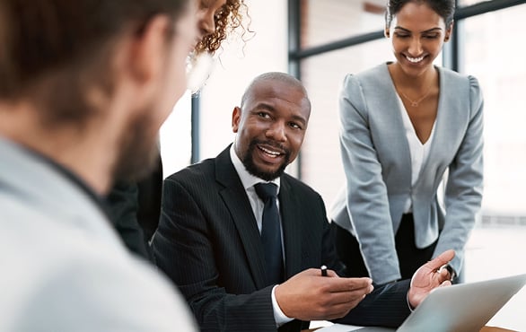 Business leaders engaged in professional communication and relationship-building during a team discussion