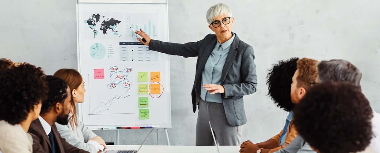 Professional woman presenting at a meeting.