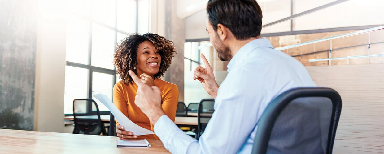 Manager and employee having a one-on-one conversation focused on engagement and workplace well-being.